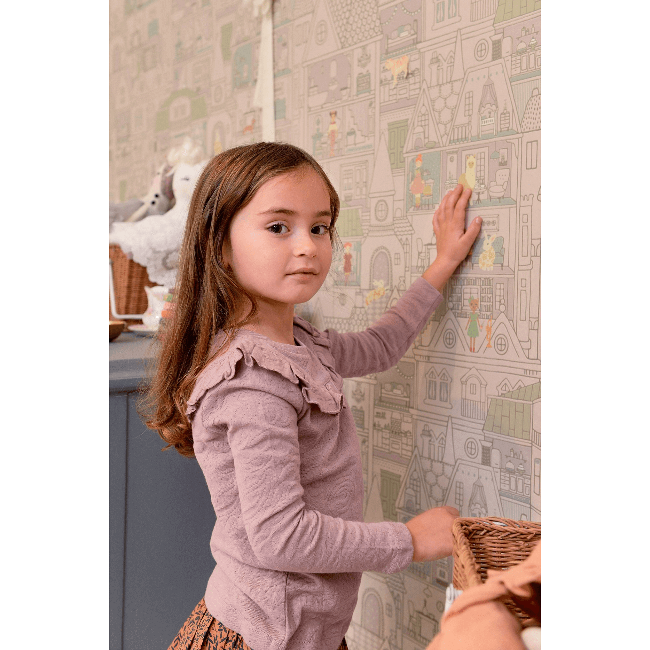 Majvillan Dollhouse Wallpaper 147-02 girl looking at camera putting stickers on wall