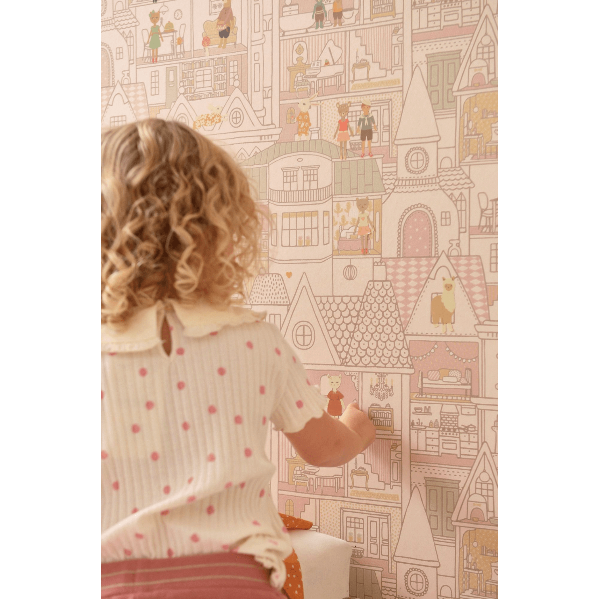 Majvillan Dollhouse Wallpaper 147-03 child with curly hair putting sticker on wall