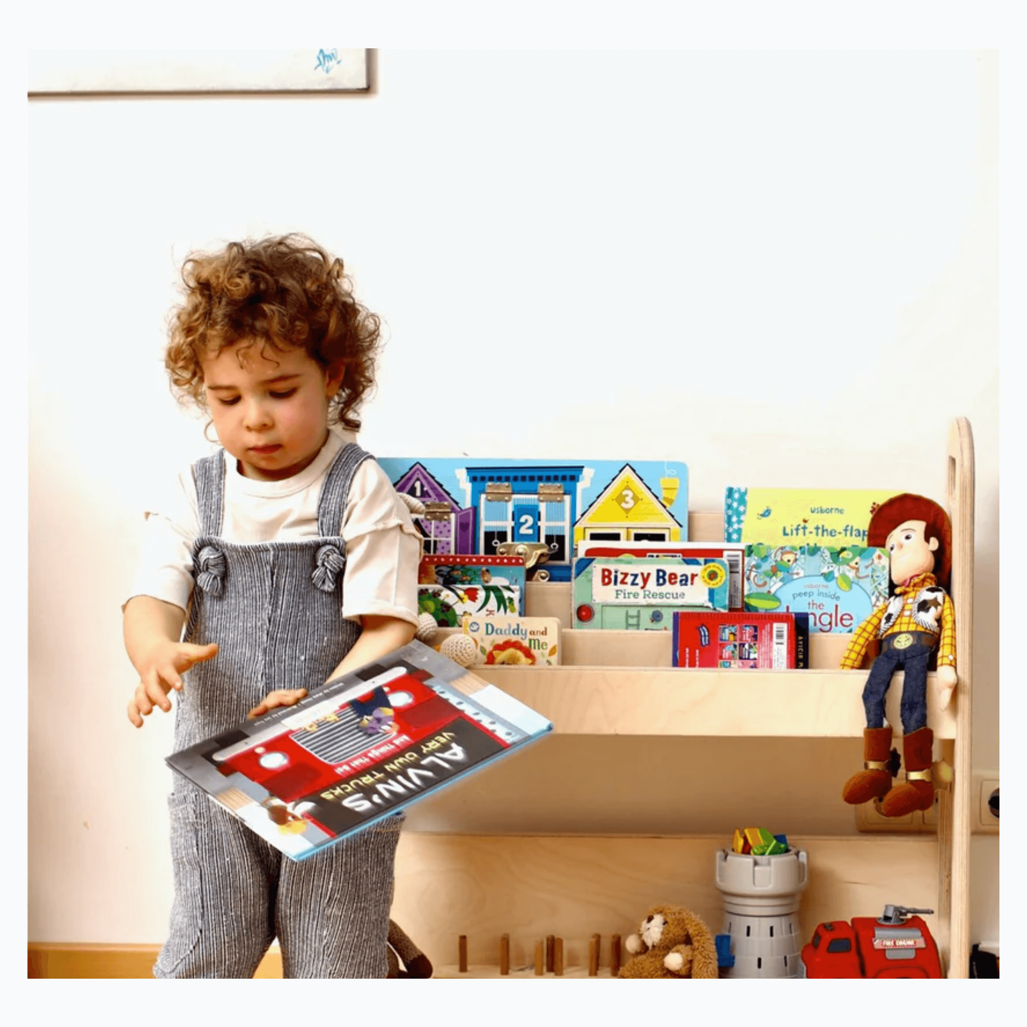 Kidodido Wooden Bookshelf KIDO18 child in front of bookshelf