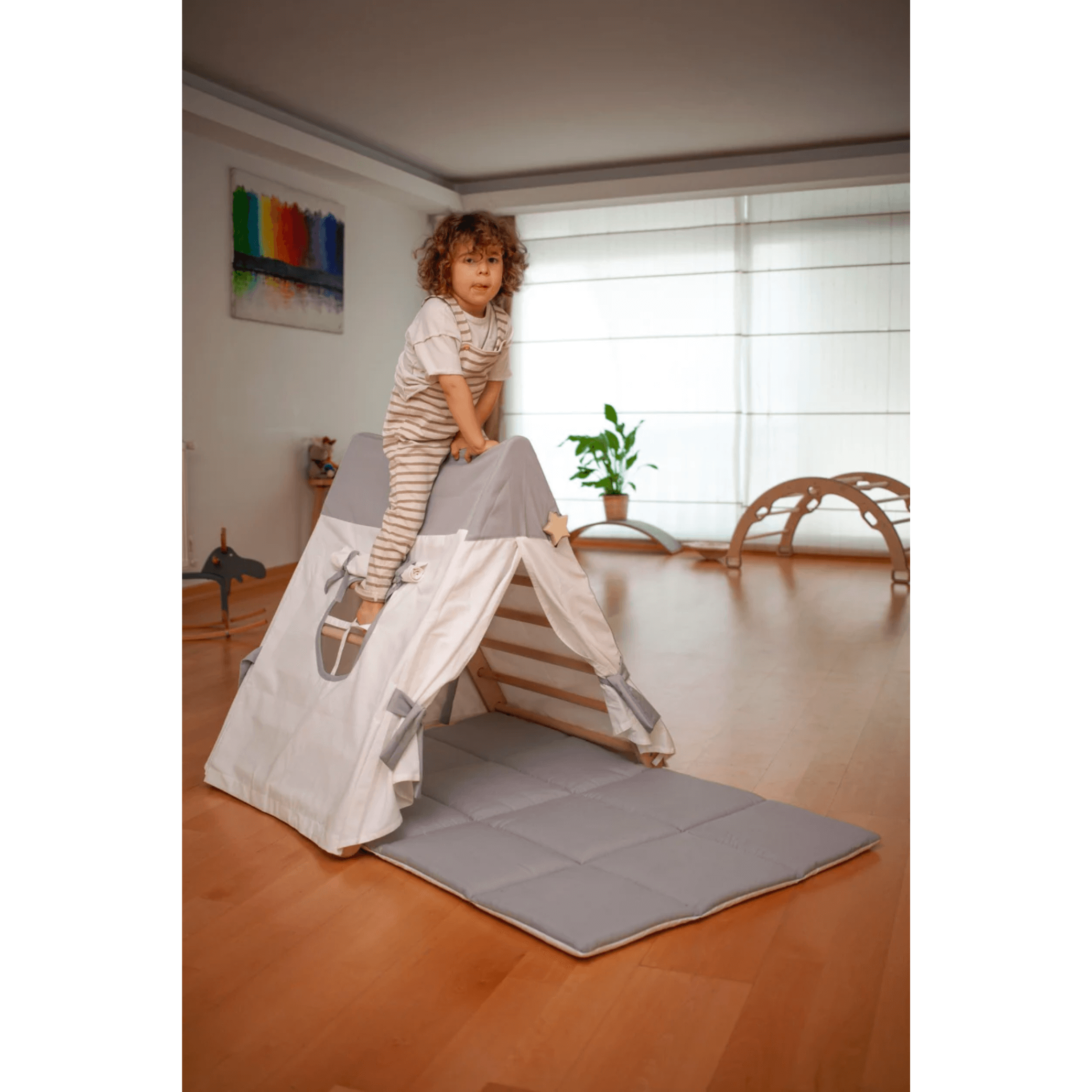 Kidodido Montessori Climbing Triangle with White & Gray Tent Cover, Mat, and Ramp left side view with child