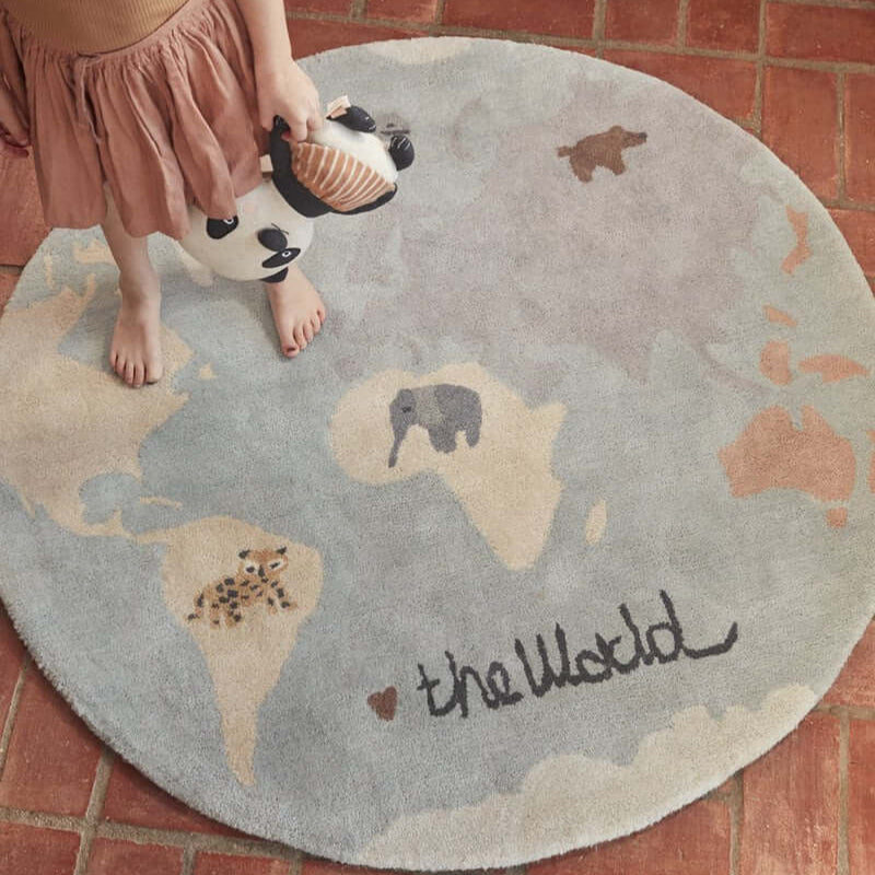 OYOY The World Tufted Kids Rug kid standing on rug